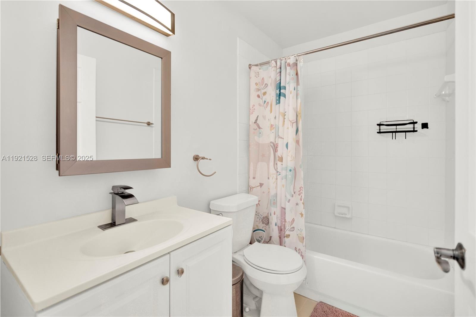 16415 Southwest 73rd Terrace Miami, FL 33193 - Photo 23 of 41 a bathroom with a sink a mirror a toilet and shower