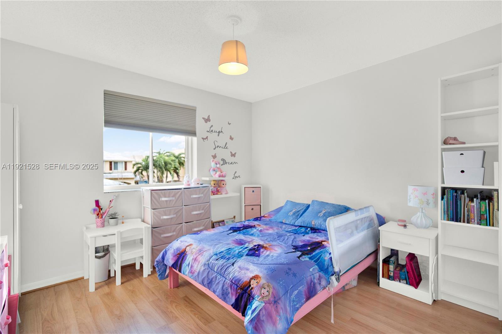 16415 Southwest 73rd Terrace Miami, FL 33193 - Photo 24 of 41 a bed room with a bed and a book shelf