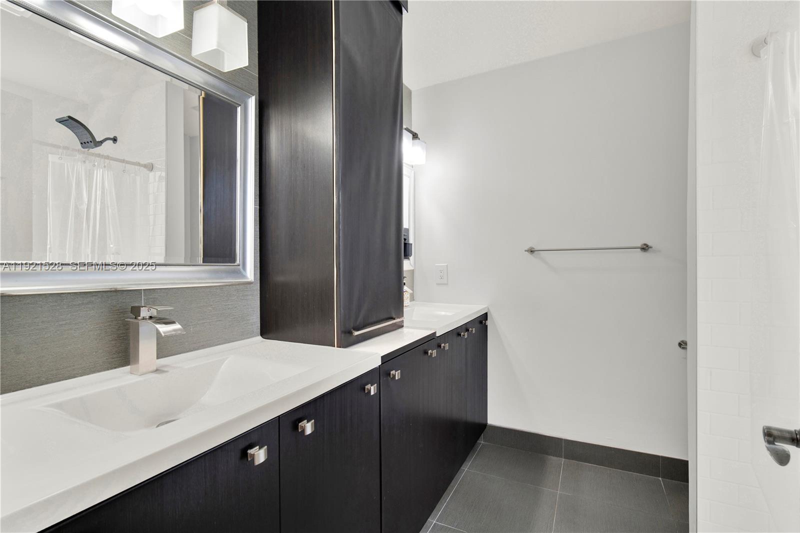 16415 Southwest 73rd Terrace Miami, FL 33193 - Photo 29 of 41 a bathroom with a sink and a mirror