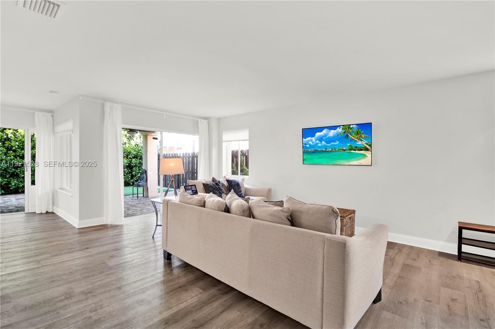 16415 Southwest 73rd Terrace Miami, FL 33193 - Photo 7 of 41 a living room with furniture and a wooden floor