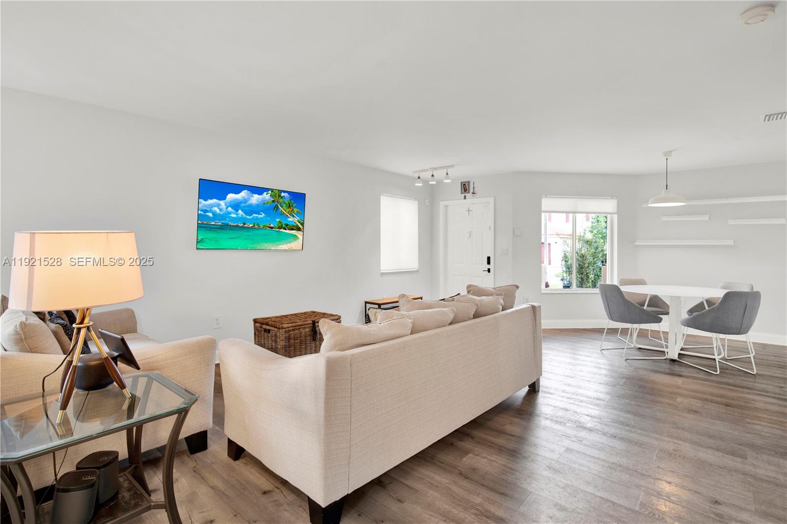 16415 Southwest 73rd Terrace Miami, FL 33193 - Photo 9 of 41 a living room with furniture and a flat screen tv