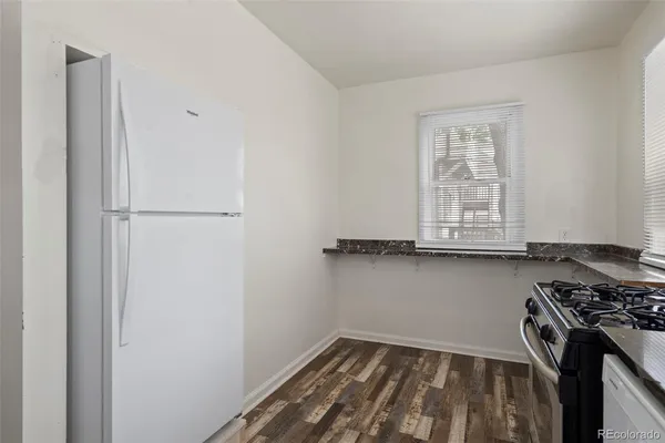 a view of a kitchen with a sink