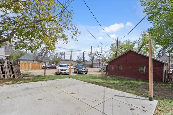 a view of a house with a backyard and a garage
