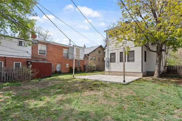 a yard that is sitting in front of a house