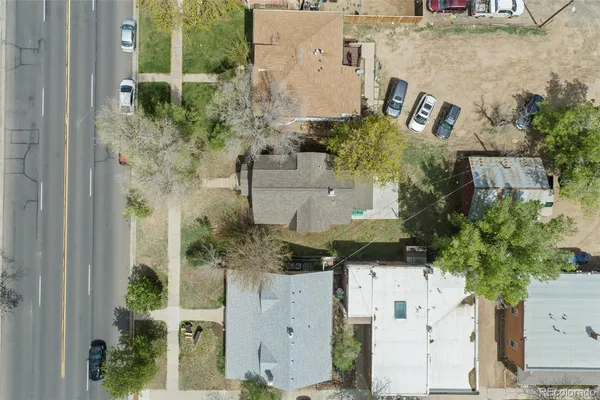 an aerial view of residential house with outdoor space and parking