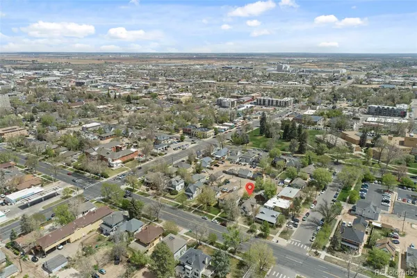 an aerial view of residential building with green space