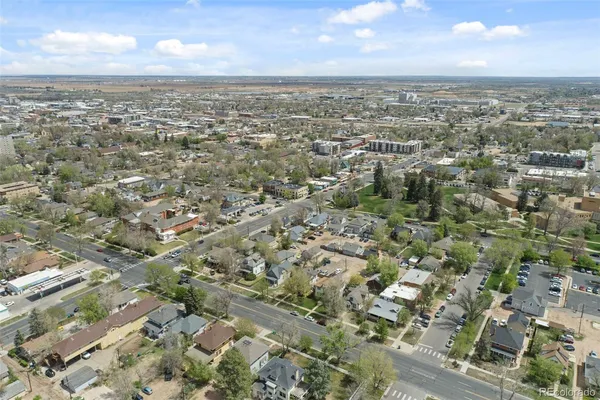 an aerial view of residential houses with outdoor space