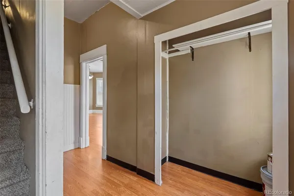 a view of front door with wooden floor