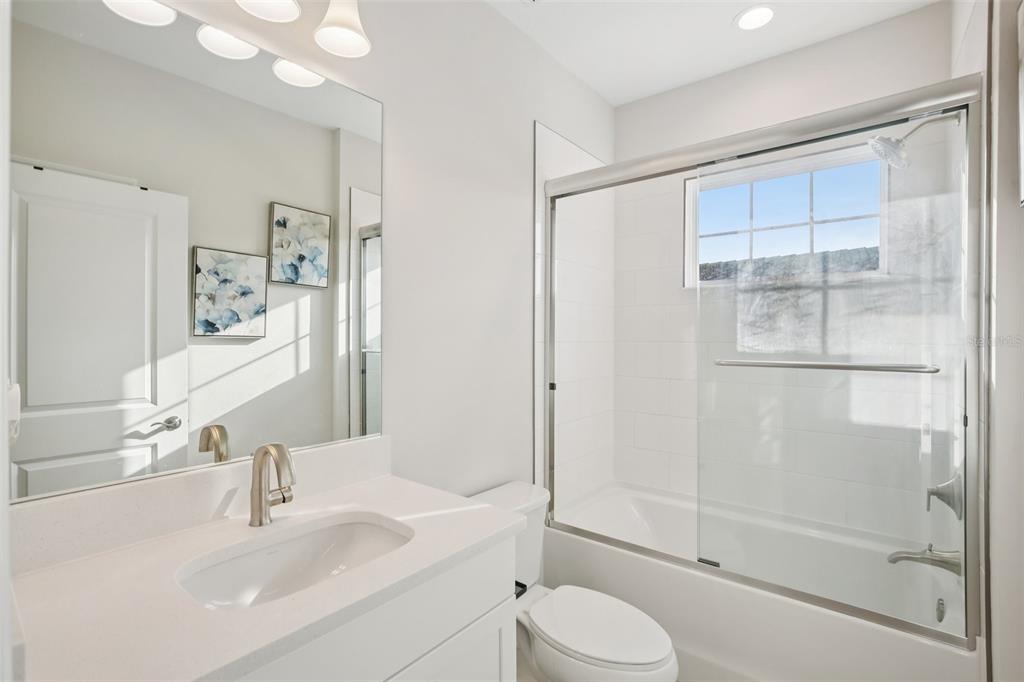 14930 Rider Pass Drive Lithia, FL 33547 - Photo 20 of 66 a bathroom with a sink toilet and shower