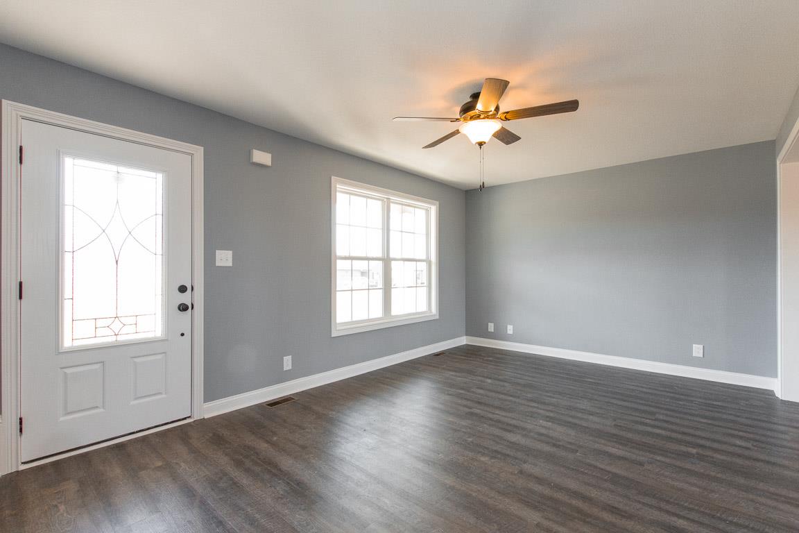 2316 Pea Ridge Road Clarksville, TN 37040 - Photo 7 of 30 wooden floor in an empty room with a window