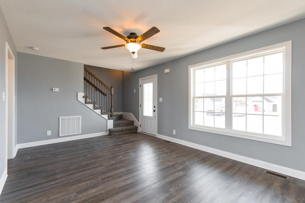 2316 Pea Ridge Road Clarksville, TN 37040 - Photo 8 of 30 a view of an empty room with wooden floor and a window