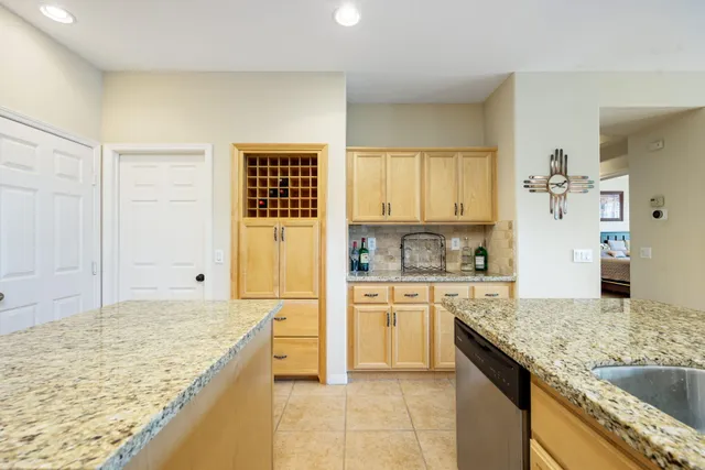 a room with pool table and windows
