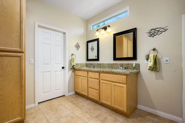 a view of swimming pool with outdoor seating and city view