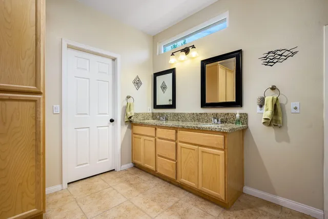 a view of swimming pool with outdoor seating and city view