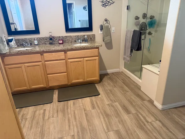 a view of a patio with table and chairs potted plants and palm trees