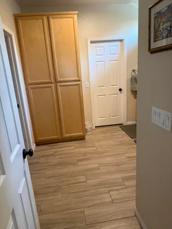 a living room with furniture a rug and a large window