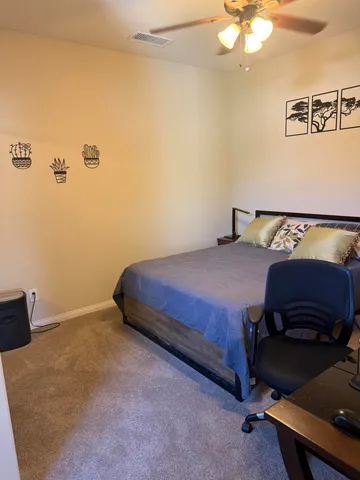 a view of a livingroom with furniture and a chandelier