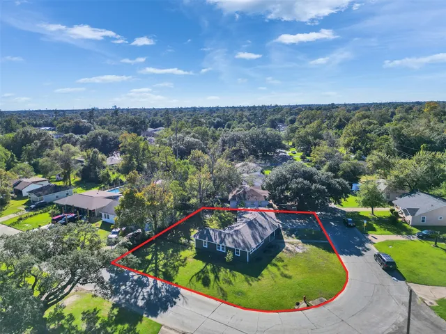 a blue swimming pool with a yard and lake view