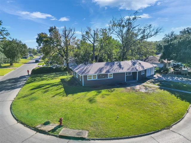 a view of a swimming pool in a backyard