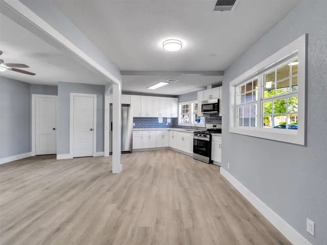 a view of kitchen with wooden floor