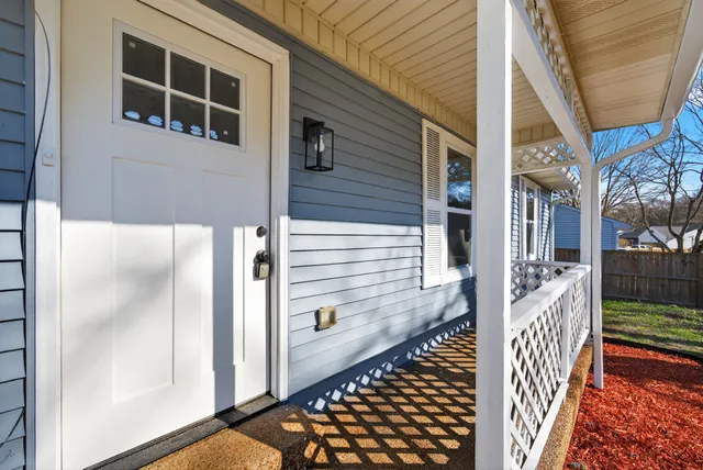 a view of a house with a yard and garage