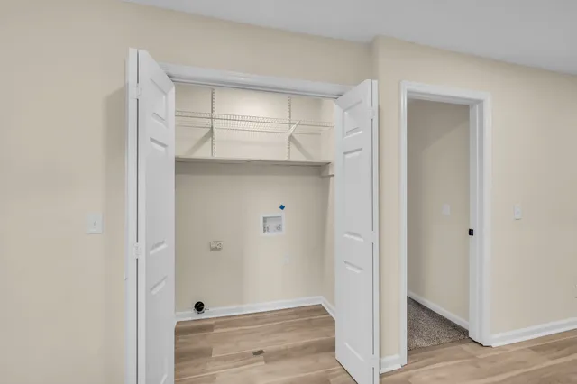 a view of an empty room with a window