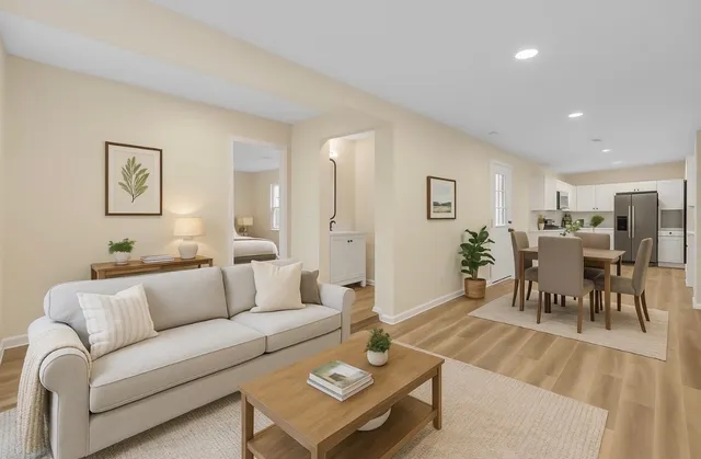 a kitchen with a sink a stove top oven and refrigerator