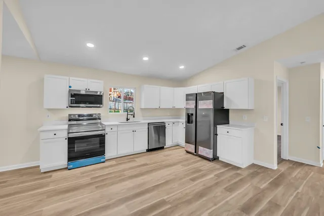 a workspace with furniture and a potted plant
