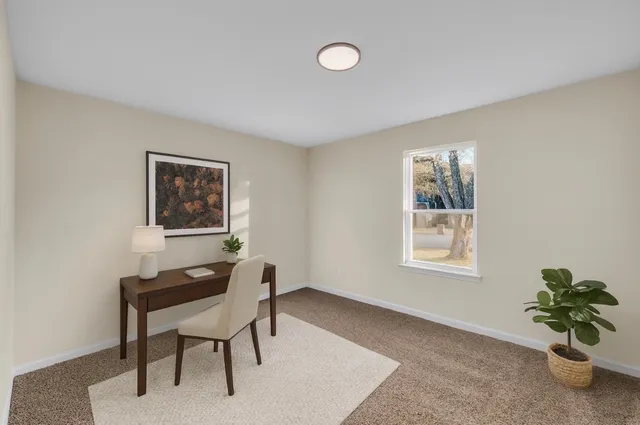 a kitchen with stove cabinets and stainless steel appliances