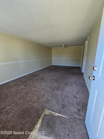 a view of a room with an empty space