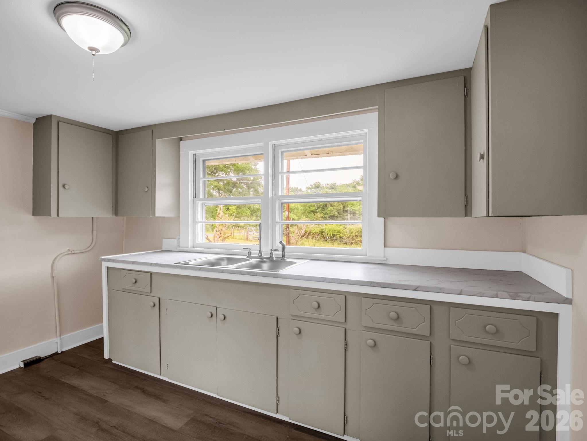 170 Dobbins Road Ellenboro, NC 28040 - Photo 27 of 32 a kitchen with a sink cabinets and window