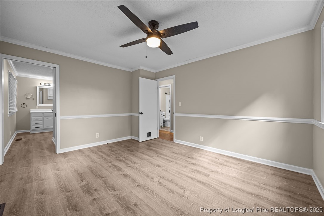 58 Eagle Road Coats, NC 27521 - Photo 11 of 49 an empty room with wooden floor and windows
