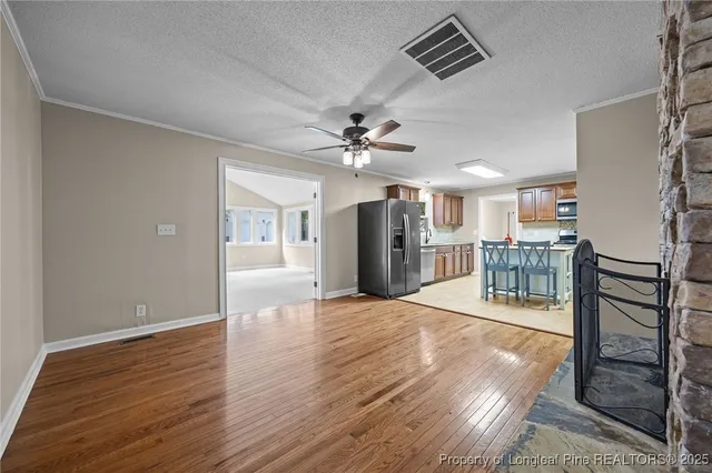 wooden floor in an empty room with a fireplace