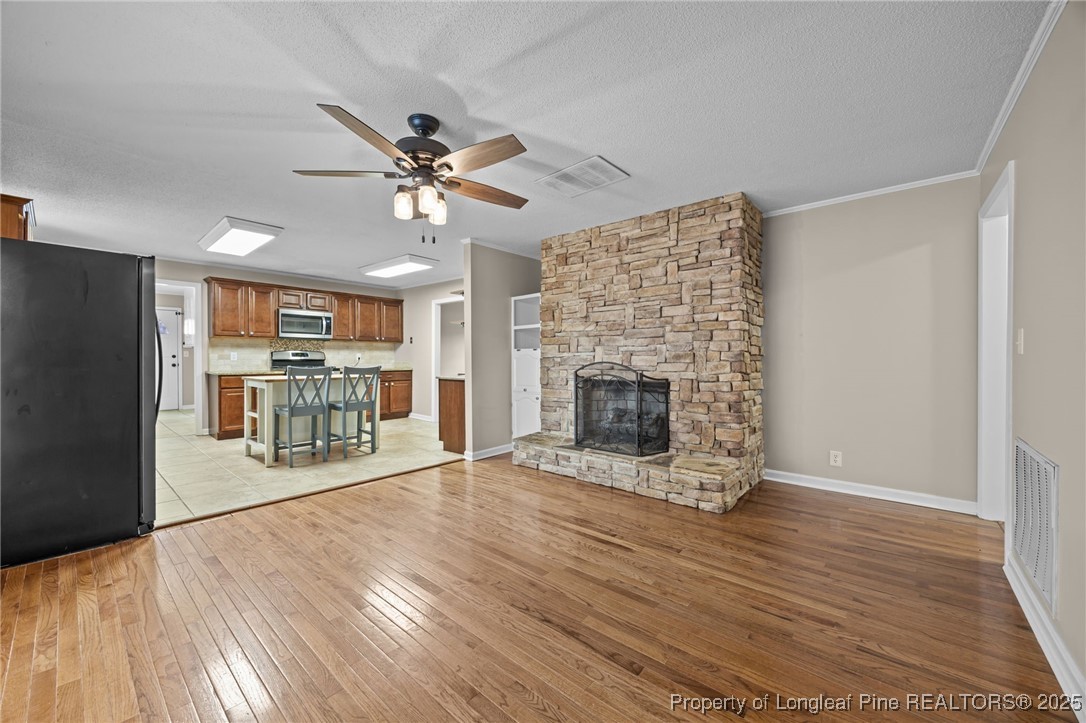 58 Eagle Road Coats, NC 27521 - Photo 20 of 49 a living room with furniture and a fireplace