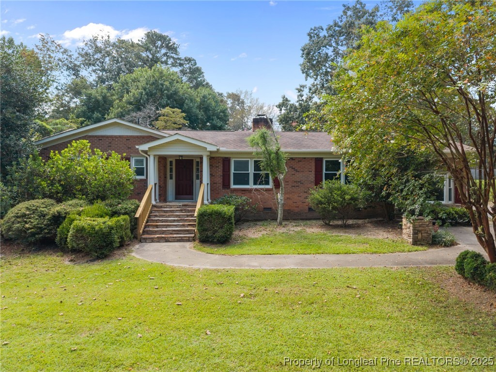58 Eagle Road Coats, NC 27521 - Photo 2 of 49 a front view of a house with swimming pool having outdoor seating