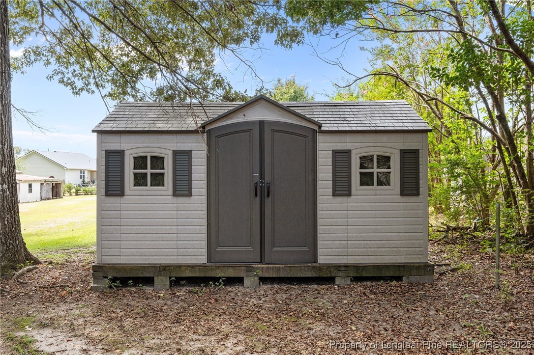 58 Eagle Road Coats, NC 27521 - Photo 42 of 49 a view of a house with a yard