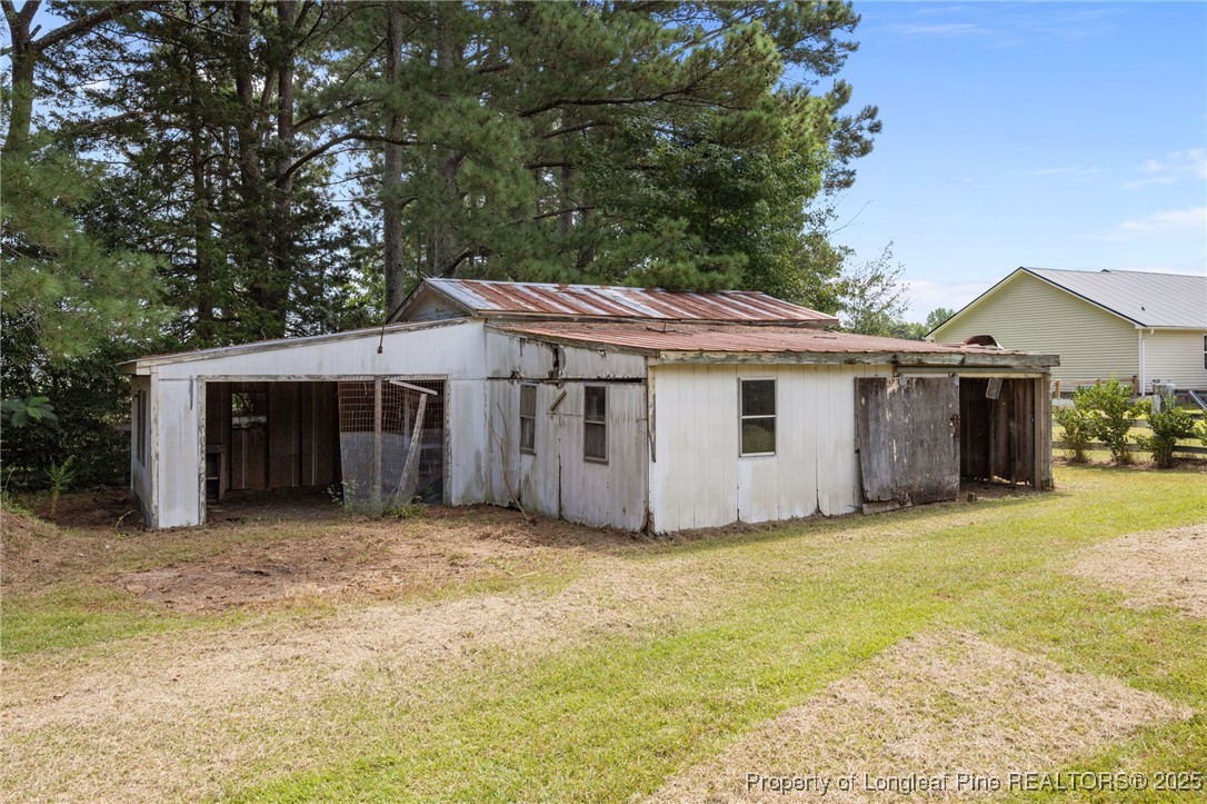 58 Eagle Road Coats, NC 27521 - Photo 44 of 49 a view of a house with a outdoor space