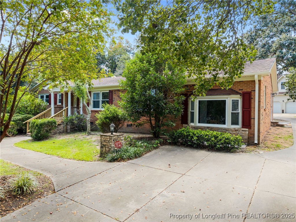 58 Eagle Road Coats, NC 27521 - Photo 5 of 49 a front view of a house with garden