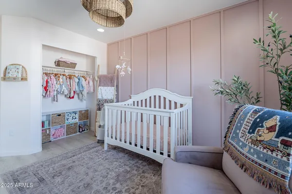a bedroom with furniture and a book shelf