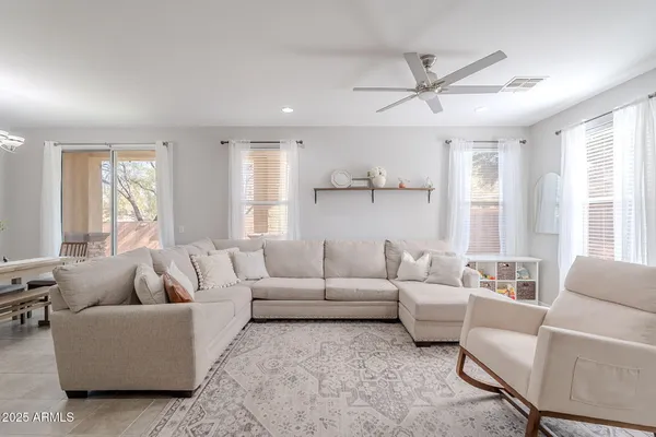 a living room with furniture and a large window
