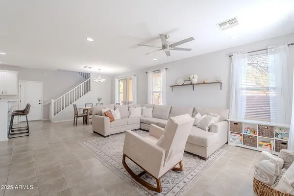 a living room with furniture and a large window