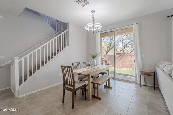 a view of a dining room with furniture window and outside view