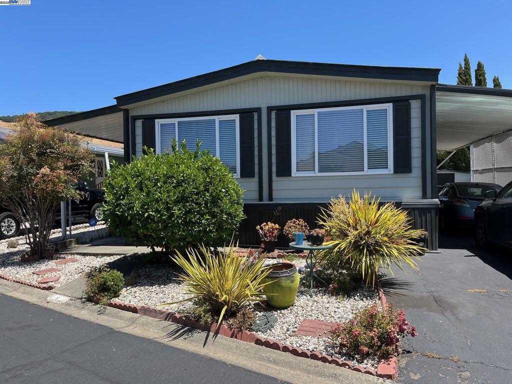 711 Old Canyon Road Fremont, CA 94536 - Photo 1 of 29 a front view of a house with sitting area