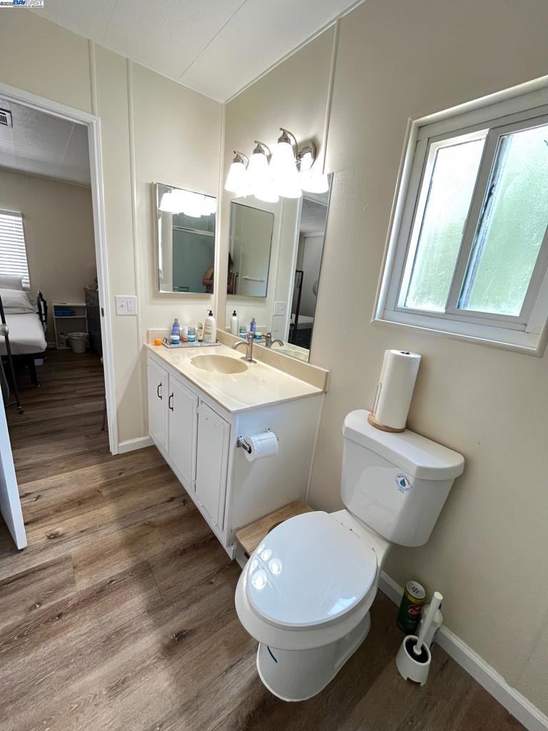 711 Old Canyon Road Fremont, CA 94536 - Photo 17 of 29 a bathroom with a toilet sink and mirror