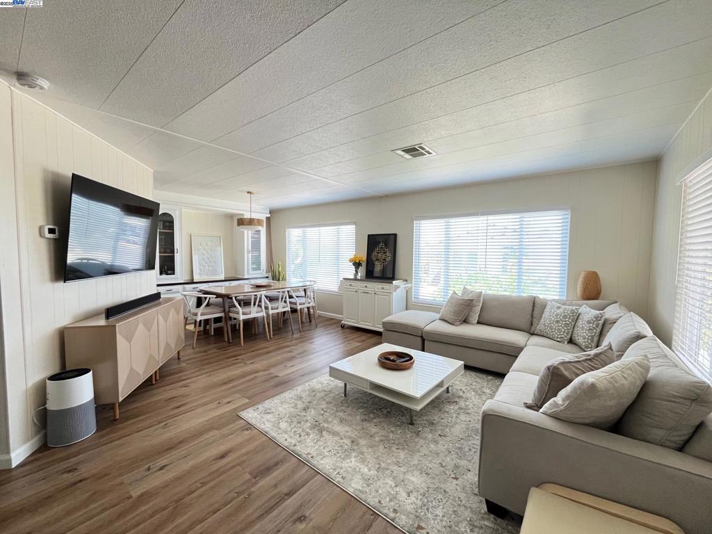 711 Old Canyon Road Fremont, CA 94536 - Photo 2 of 29 a living room with furniture and a flat screen tv