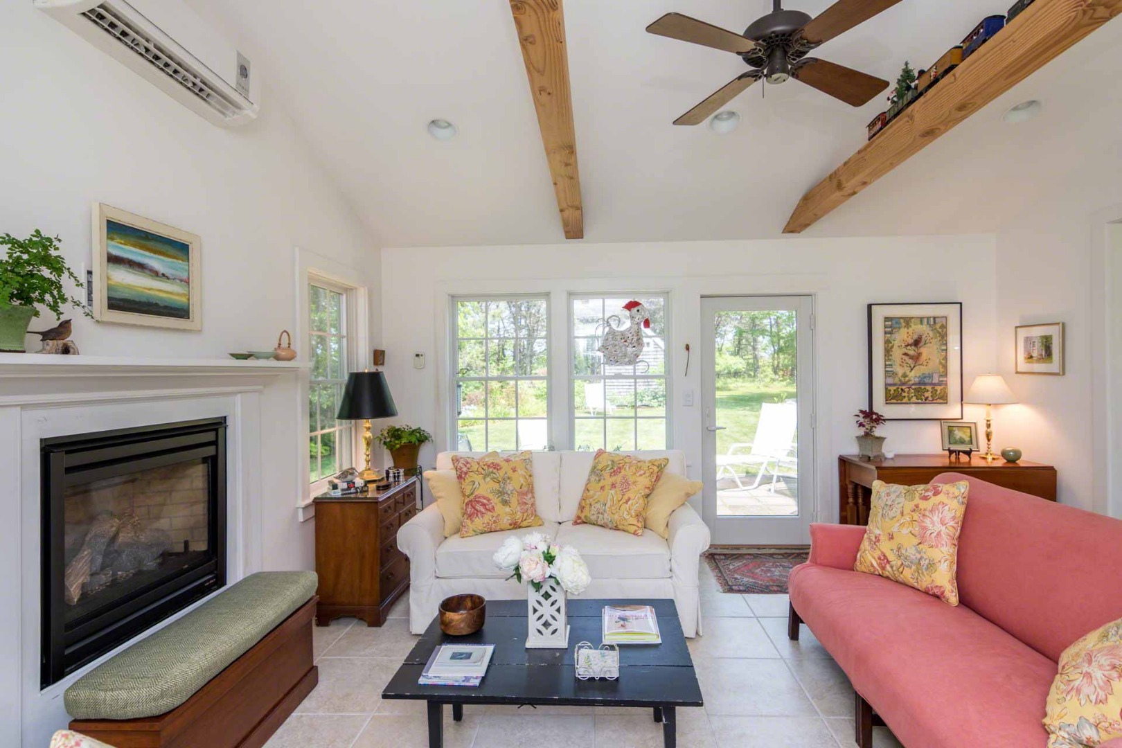 1 Garden Cove Road Edgartown, MA 02539 - Photo 11 of 37 a living room with furniture a fireplace and a flat screen tv