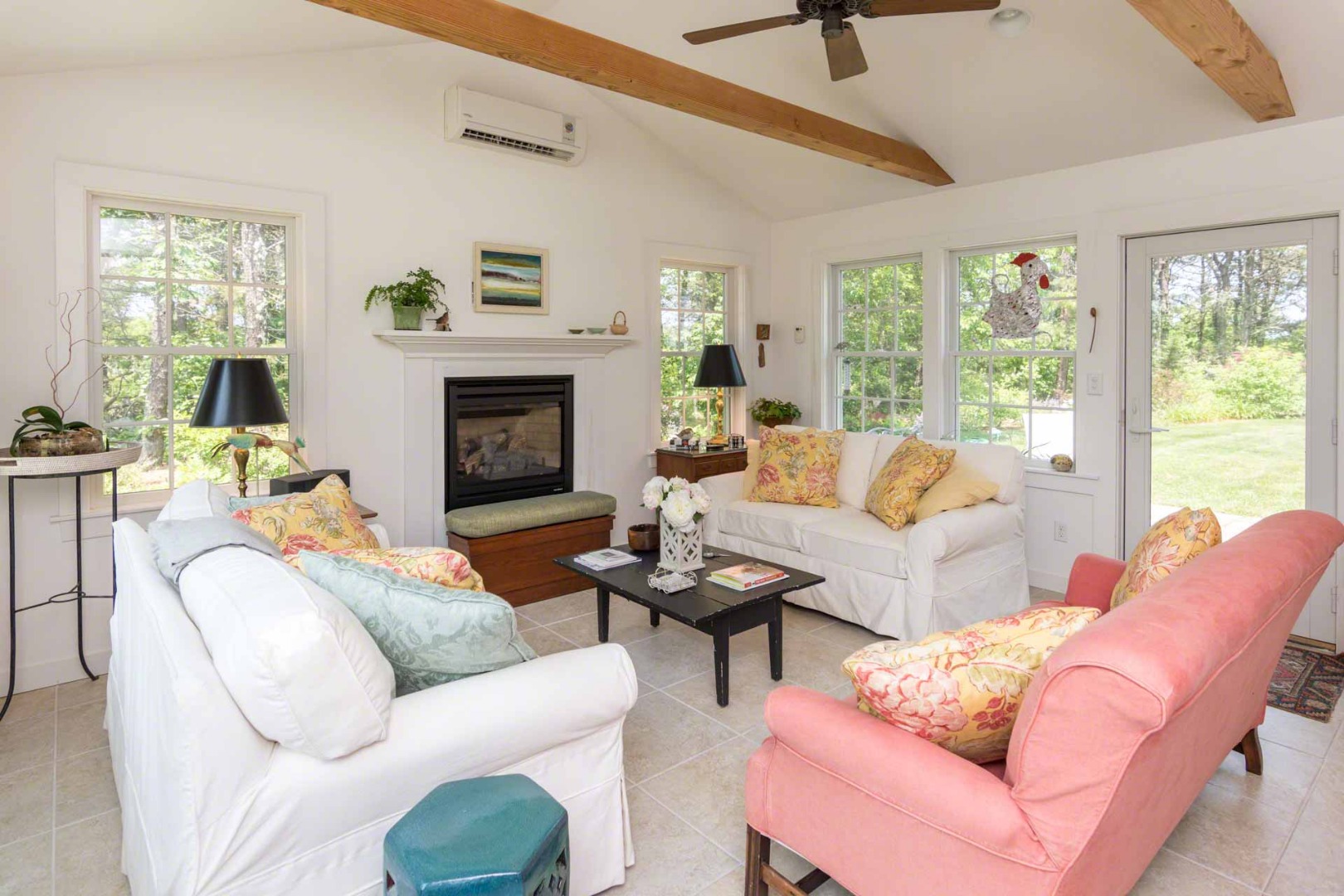 1 Garden Cove Road Edgartown, MA 02539 - Photo 12 of 37 a living room with furniture a fireplace and a window