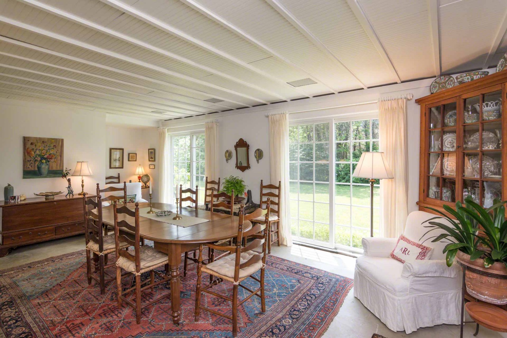 1 Garden Cove Road Edgartown, MA 02539 - Photo 14 of 37 a view of a dining room with furniture window and outside view