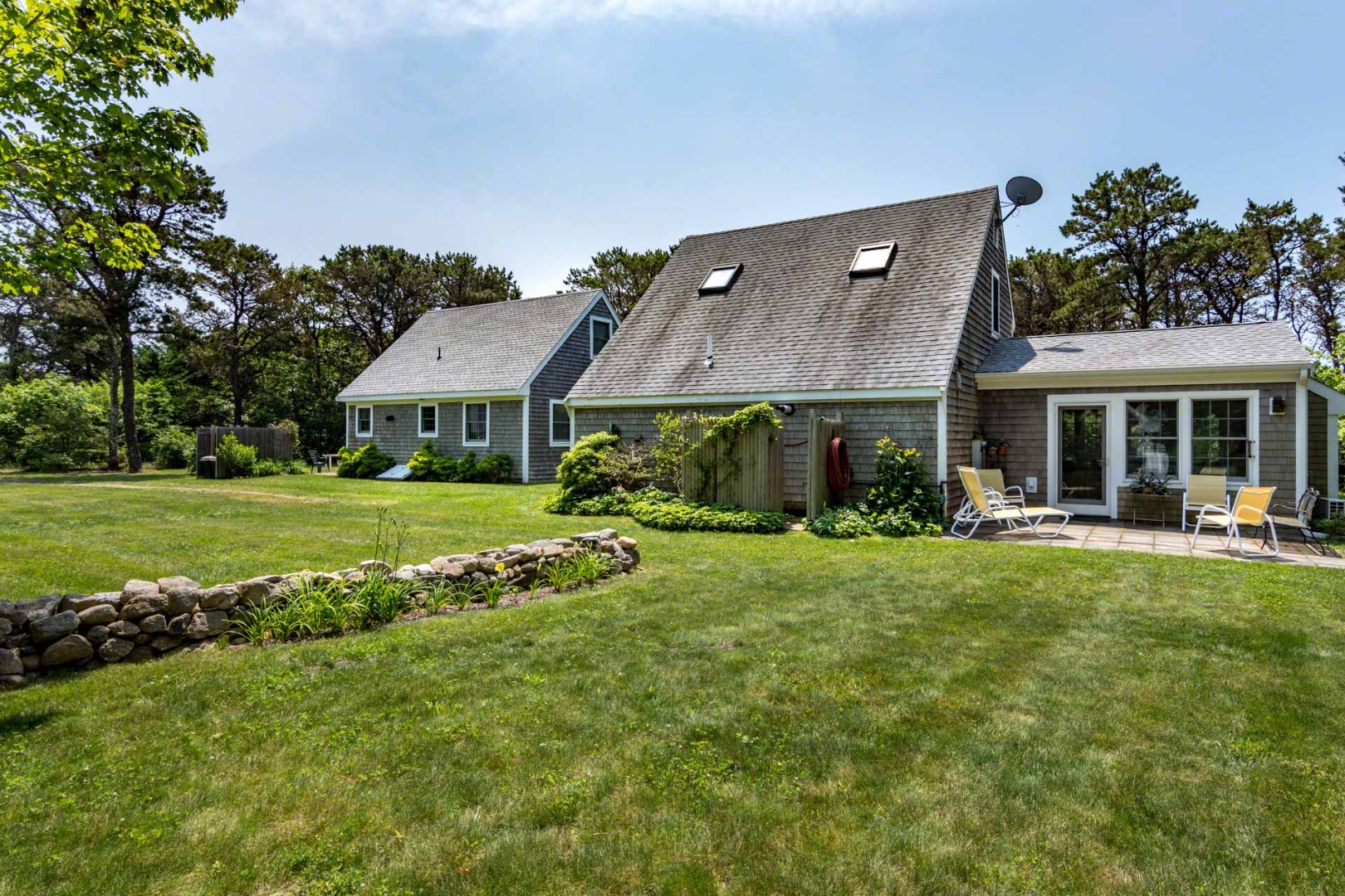 1 Garden Cove Road Edgartown, MA 02539 - Photo 3 of 37 a view of a house with a big yard and large trees