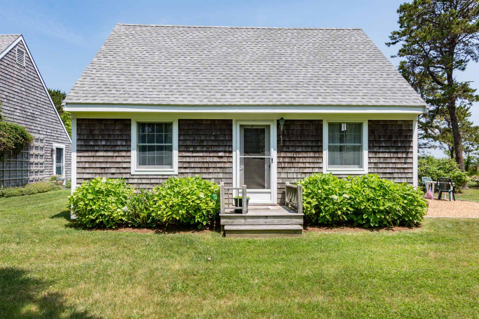 1 Garden Cove Road Edgartown, MA 02539 - Photo 27 of 37 front view of a house with a yard